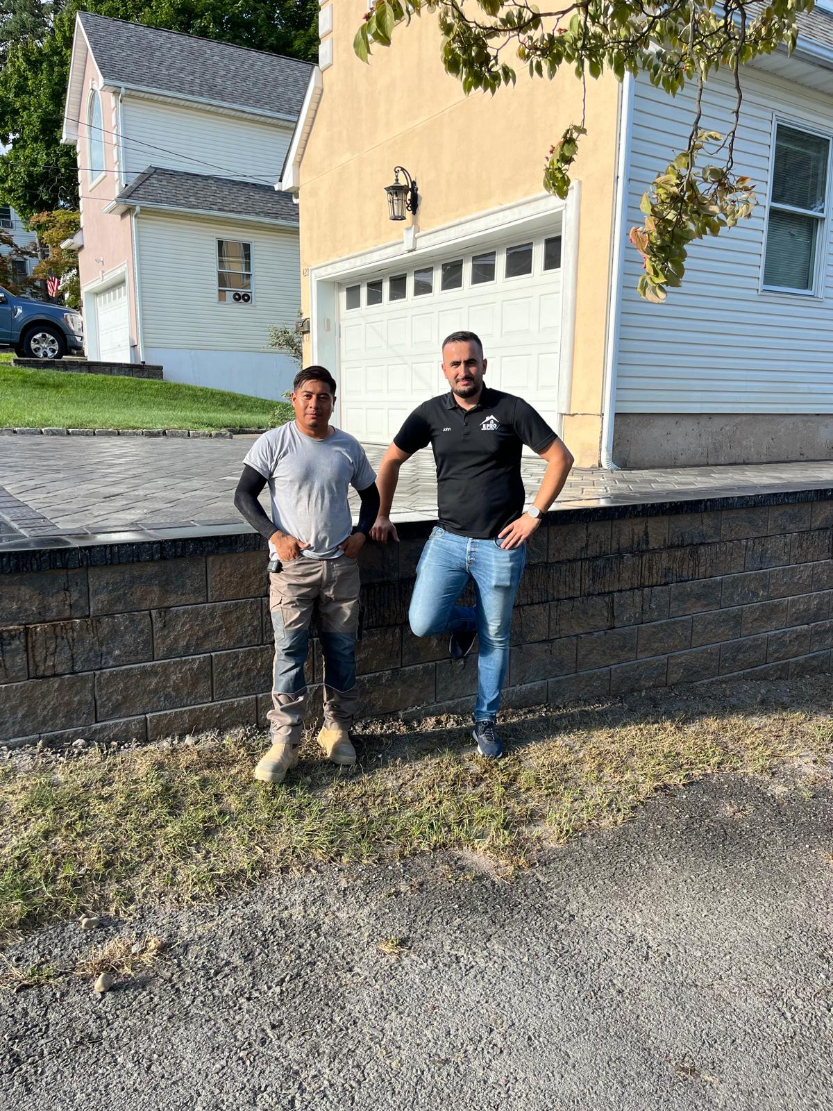 Ervis Dogjani, also known as John, possing for a photo. John, owner and master mason of E Pro Construction overseeing masonry work in Passaic County NJ