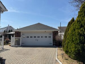 Front house view with new roof and gutters systems in nj